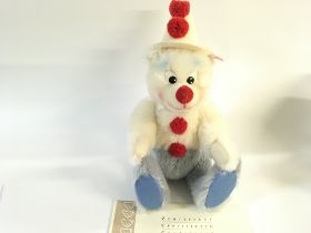 A Steiff teddy bear clown in box with certificate.