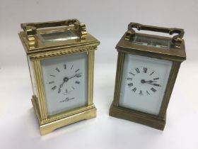 Two brass carriage clocks. Shipping category D.