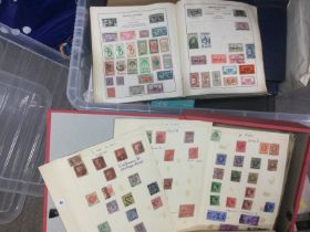 Two boxes of albums of world of postage stamps. Sh