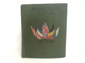 A vintage postcard album with various postcards of