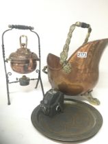 An ornate brass and wrought iron kettle on stand a
