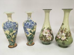 Two pairs of of hand painted Lambeth Doulton vases