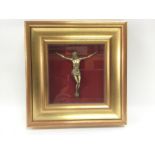 A gilt framed wall ornament of Christ, approx 29.5cm x 31cm. Shipping category D.