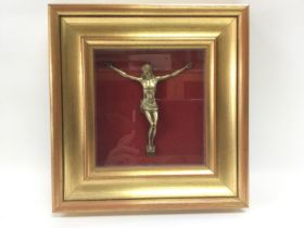 A gilt framed wall ornament of Christ, approx 29.5cm x 31cm. Shipping category D.