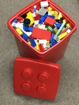 A box of various Lego pieces. Postage category C