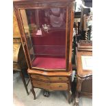 A display cabinet. Approx 146x62.