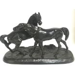 A Soviet Russian black metal statue of two horses,