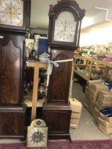 A mahogany long case clock case together with two movements- brass dial and silver dial- Mich