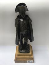 A bronze figure of Napoleon on a stepped marble base. 36cm in height