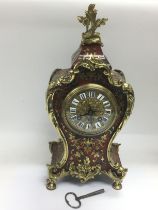 A French tortoiseshell and brass inlaid boulle clo