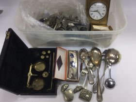 A box of oddments including various silver plated