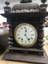 A walnut mantle clock with applied carvings the ci