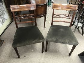 A reproduction dining table and six chairs.