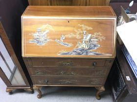 A lacquer bureau with oriental style artwork. 76w