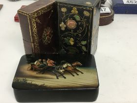 A small Russian lacquer box painted with horse and