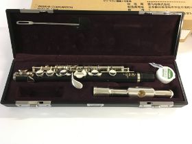 A cased Yamaha Piccolo model YPC-32. Appears new and unused. Postage B.