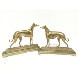 A pair of 19th century brass greyhound ornaments a