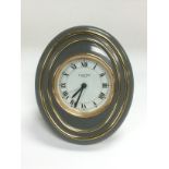 A Cartier oval alarm clock, approx height 10cm. Shipping category B.