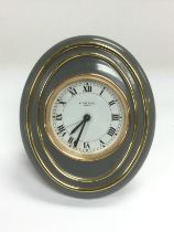 A Cartier oval alarm clock, approx height 10cm. Shipping category B.