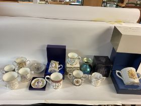 A collection of commemorative ceramics including R