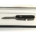 A Victorinox pocket tool with damask blade. Limite
