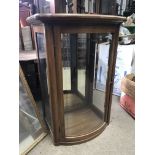 A small Edwardian mahogany display cabinet with bow fronted single door