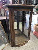 A small Edwardian mahogany display cabinet with bow fronted single door