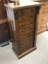 A seven drawer Mahogany Wellington chest, dimensio