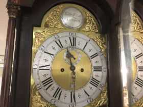 A Georgian mahogany long case clock the arched dia