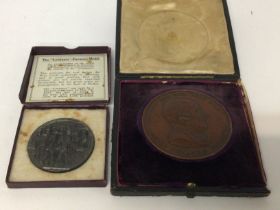 A boxed Lusitania medal and a college presentation plaque. Postage B