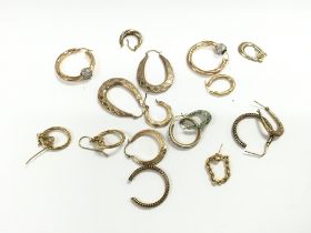 A collection of assorted 9ct gold earrings. 21.58g