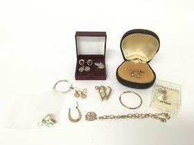 A collection of silver, 9ct gold and other earring
