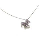 A white gold chain with pink sapphire and diamond