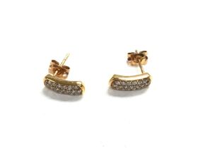 A pair of 9ct gold diamond earrings. 1.7g and 0.36