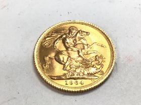 A 1964 full gold sovereign. Postage A