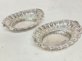 A pair of hallmarked silver dishes, diameter of ap