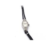 An Art Deco style ladies wrist watch. Winds and ru