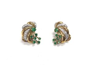 A pair of 18ct gold emerald and diamond earrings.