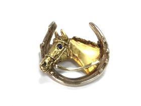 A Harriet Glen 18ct gold horse hoof head brooch. 9