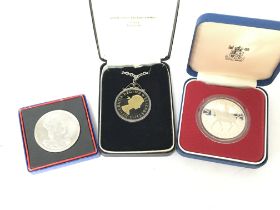 Commemorative boxed coins including a silver coin