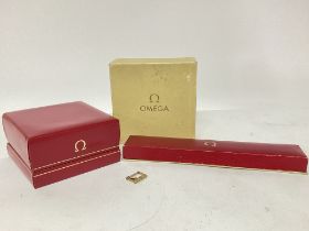 Omega boxes and an Omega watch buckle