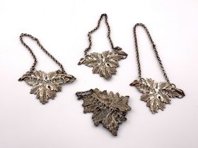 4 hallmarked silver wine labels with leaf design,