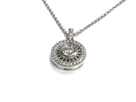 An 18ct white gold diamond pendant and chain. 5g.