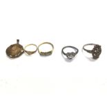A collection of 9ct gold and silver rings and a lo