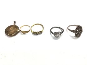 A collection of 9ct gold and silver rings and a lo