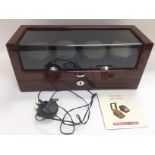 An automatic multi watch winder with wood effect finish, instructions and power supply. Shipping