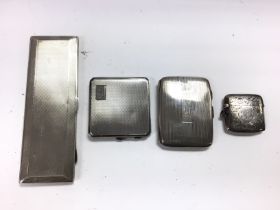 A collection of various silver cases and compact.