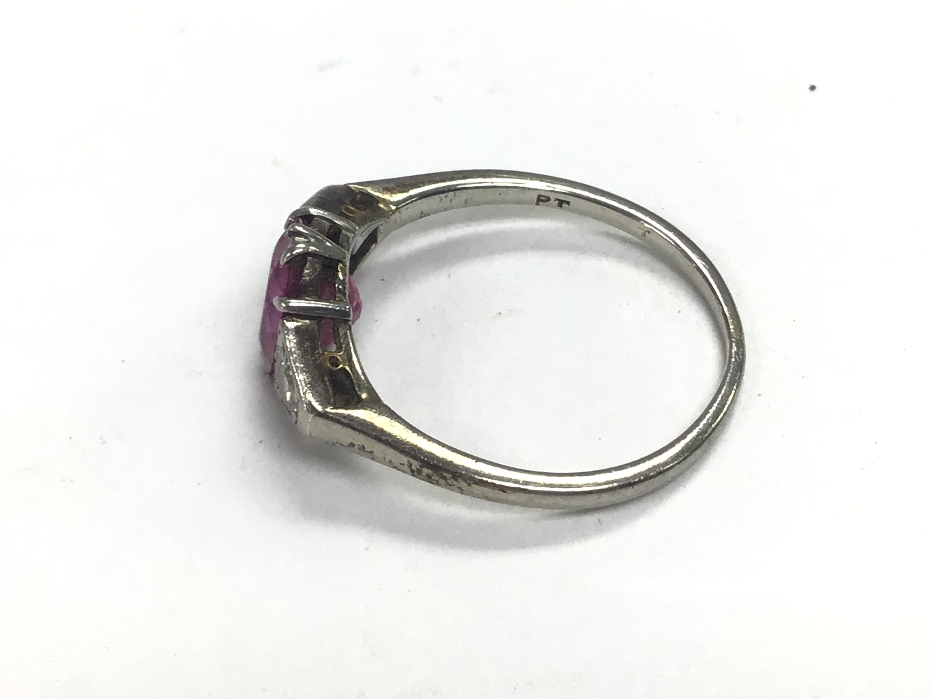 A platinum ring set with a central ruby and white - Image 2 of 2