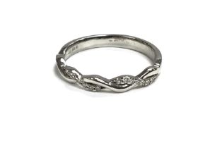 A platinum diamond twist ring. Approximately 3.7g