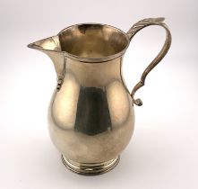 A hallmarked silver sparrow beak jug with marks fo